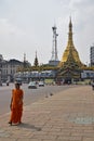 An Indian woman walking away from Sule Pagoda in Yangon, Myanmar Royalty Free Stock Photo