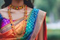 Indian woman wearing vibrant traditional saree
