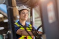 Indian woman worker warehouse forklift driver staff happy smiling enjoy working Royalty Free Stock Photo