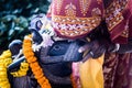 An Indian woman worships the sacred bull Nandi.