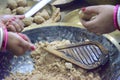 Indian women making chapati and thekua or sweets during the festival of Chhath Puja. Royalty Free Stock Photo