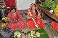 Indian women offering her prayers with fruits and chapati or bananas during the festival of Chhath Puja.