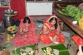 Indian women offering her prayers with fruits and chapati or bananas during the festival of Chhath Puja.