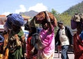 Indian Women Pilgrims Carrying Luggage on Head Royalty Free Stock Photo