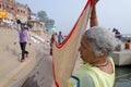 Indian women pilgrims drying their sarees at ghats of varanasi