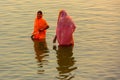 Indian women pray and devote for Chhath Puja festival on Ganges river side in Varanasi,India