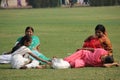 Indian women relaxing on the grass i