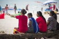 Indian women sitting on the beach of Patong Phuket Thailand. 24 December 2018