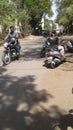 Indian Women sitting on motorcycle in the street