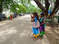 Indian women standing on street in Agra, India