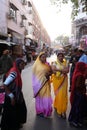 Indian women with traditional colored sari on the street of Pushkar