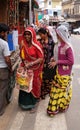 Indian women with traditional colored sari on the street of Pushkar