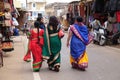 Indian women with traditional colored sari on the street of Pushkar