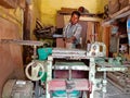 an indian worker operating wood chopping machine at factory in India January 2020 Royalty Free Stock Photo