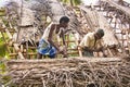 Indian workers covered the top of the log cabin with coconut leaves to serve tourists