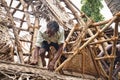 Indian workers covered the top of the log cabin with coconut leaves to serve tourists