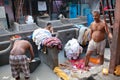 Indian workers washing clothes at Dhobi Ghat in Mumbai, India