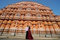 Indian young beautiful couple standing infront of Hawamahal Jaipur Rajasthan