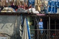 Indian young boy in Dhobi Ghat is outdoor laundry in Mumbai. India Royalty Free Stock Photo