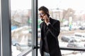 Indian young business man use phone in modern office Royalty Free Stock Photo
