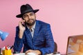 Indian young businessman sitting at workplace Royalty Free Stock Photo