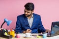 Indian young businessman sitting at workplace Royalty Free Stock Photo