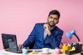 Indian young businessman sitting at workplace Royalty Free Stock Photo