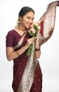 Indian young girl with pink flowers Royalty Free Stock Photo