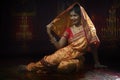 Indian young lady performing traditional dance