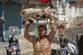 indian young woman on the head of thick bamboo stalks