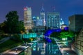 The Indiana Central Canal and downtown skyline at night in Indianapolis, Indiana