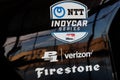 Logo of NTT IndyCar series and sponsors Firestone and Verizon. IndyCar is the premier level of open-wheel racing I