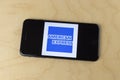 American Express logo on a smartphone. American Express is a world leader in the financial, credit and charge card industry