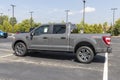 Ford F-150 display at a dealership. The Ford F150 is available in XL, XLT, Lariat, King Ranch, Platinum, and Limited models Royalty Free Stock Photo