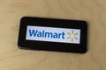 Walmart logo on a smartphone. Walmart introduced its Veterans Welcome Home Commitment and plans on hiring 265,000 veterans