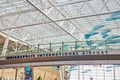 Indianapolis International Airport bridge sign with hanging blue art decor