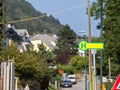 Selective blur on a typical austrian and german bus stop sign, called haltestelle, or bushaltestelle, in a suburban environment.