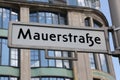Street of Berlin in the road sign called Mauerstrasse that means Royalty Free Stock Photo