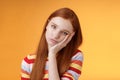 Indifferent careless sleepy redhead silly female student lean palm looking bored uninterested listen lame stories wanna