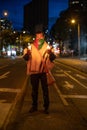 Indigenous adult holding candles during a protest