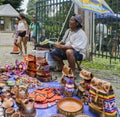 Indigenous Brazilian man selling arts and crafts at a street mar