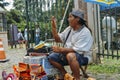 Indigenous Brazilian man selling arts and crafts at a street mar