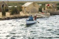 Indigenous couple from the Uros Islands fishing on Lake Titicaca