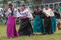 indigenous female dancers performing at a rodeo