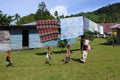 Indigenous Fijian woman and her children in a local village Fiji