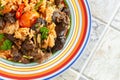 Indigenous Ghanaian, African-Caribian food Jollof Rice with tomato sauce, regional spices, chicken meat and offal Royalty Free Stock Photo