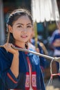 Indigenous girl holding counterpoise with 2 enameled basin of food in parade Royalty Free Stock Photo