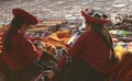 Indigenous Inca woman working with textils in the Chinchero market , Cusco, Peru UNESCO world heritage city