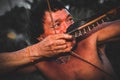 Indigenous man of the Asuruni tribe flexing a bow with an arrow Royalty Free Stock Photo