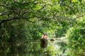 Indigenous Man With Canoe In Amazon Basin Royalty Free Stock Photo